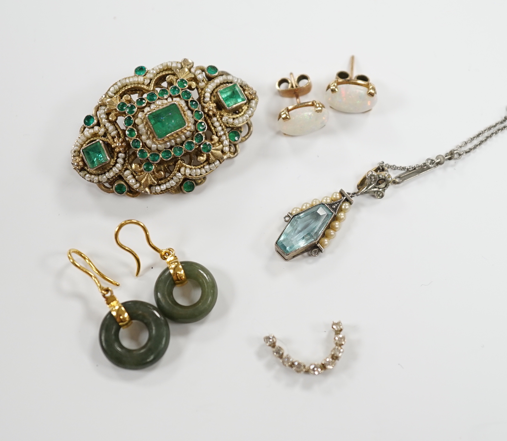 Sundry jewellery including a 19th century Austro-Hungarian gilt white metal, emerald and seed pearl cluster set brooch, 38mm, two pairs of earrings including white opal, a pendant necklace and part of a ring.